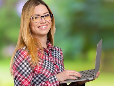 young-female-working-laptop 2300×766